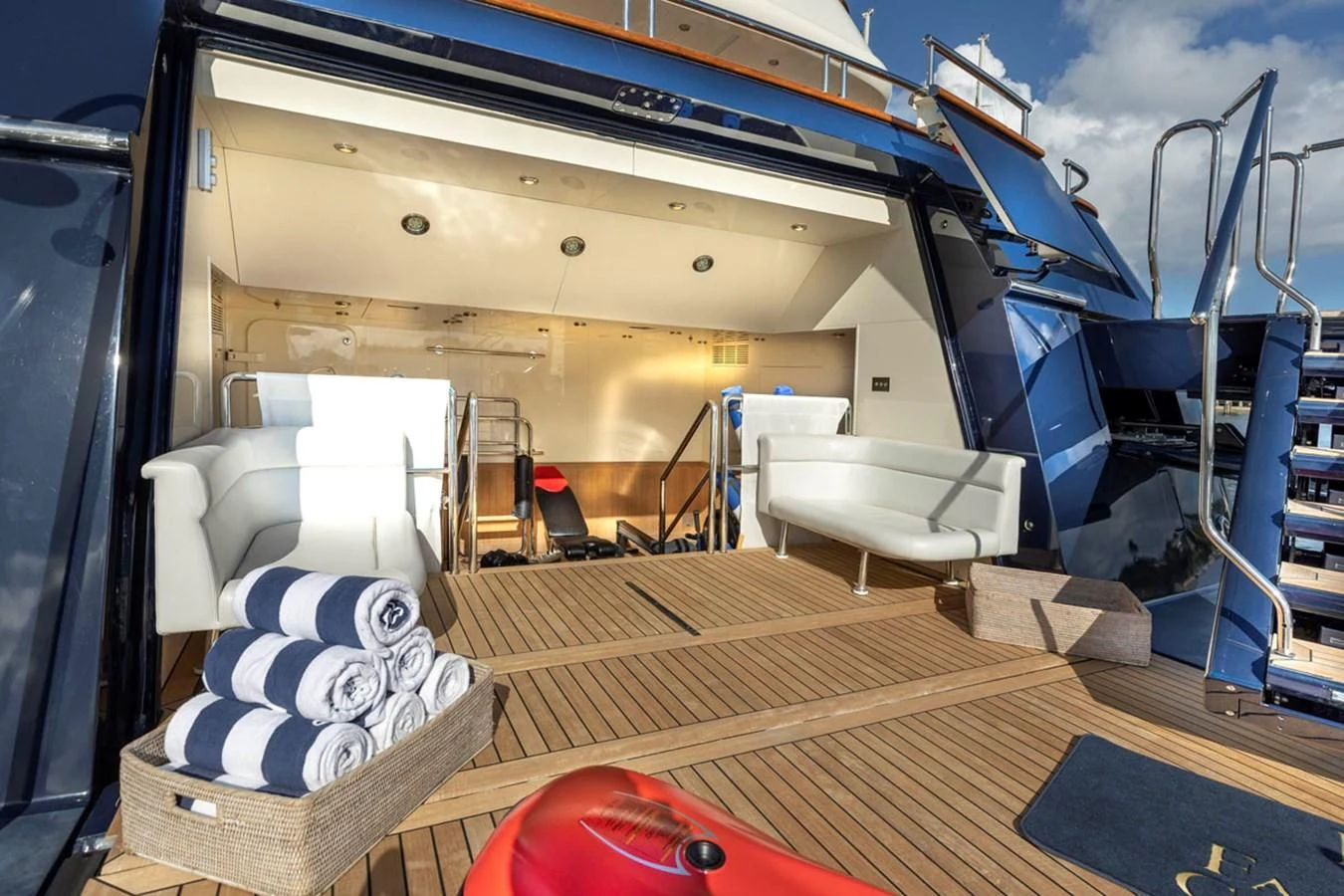 a room with a bed and a chair aboard FABULOUS CHARACTER Yacht for Charter