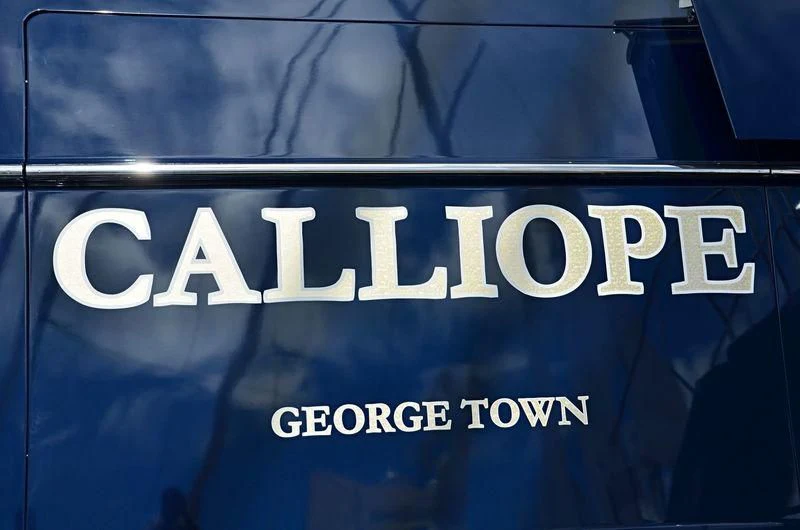 a sign on a blue background aboard FABULOUS CHARACTER Yacht for Charter
