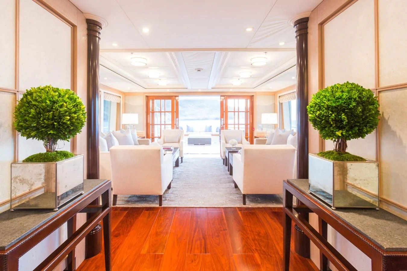 a living room with a large window aboard FABULOUS CHARACTER Yacht for Charter