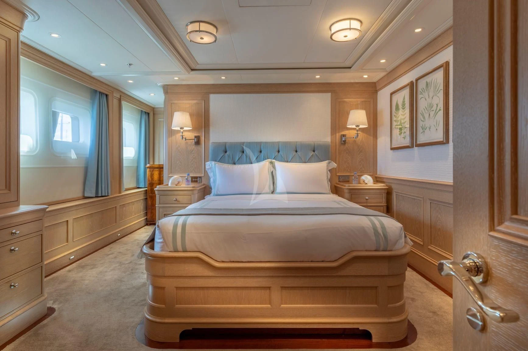 a large bed in a room aboard FABULOUS CHARACTER Yacht for Charter