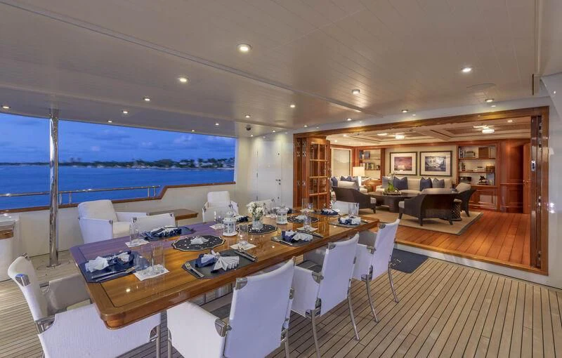 a large conference room with a large table and chairs aboard FABULOUS CHARACTER Yacht for Charter