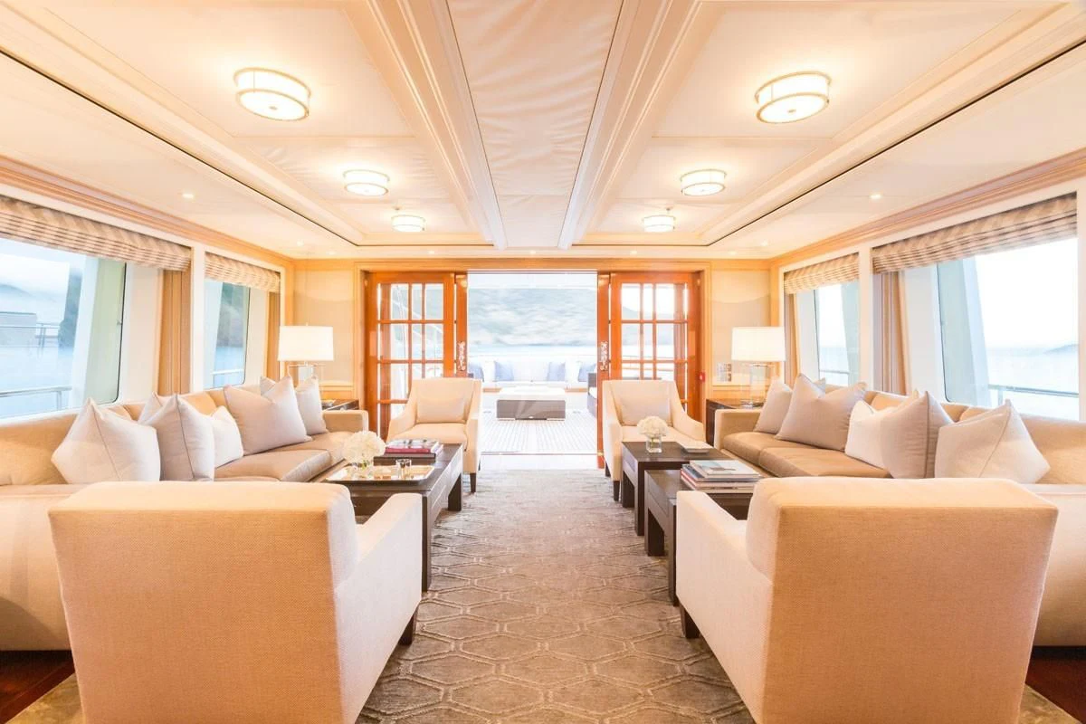 a living room with a large window aboard FABULOUS CHARACTER Yacht for Charter