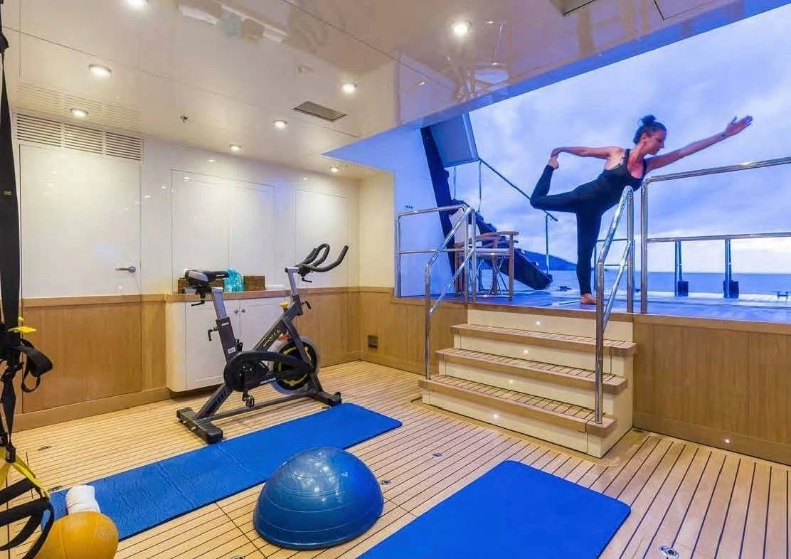 a person standing on a ladder aboard FABULOUS CHARACTER Yacht for Charter