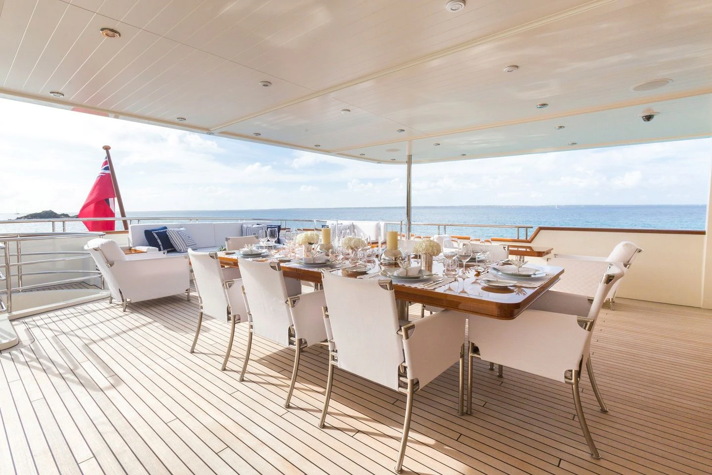 a room with a table and chairs aboard FABULOUS CHARACTER Yacht for Charter