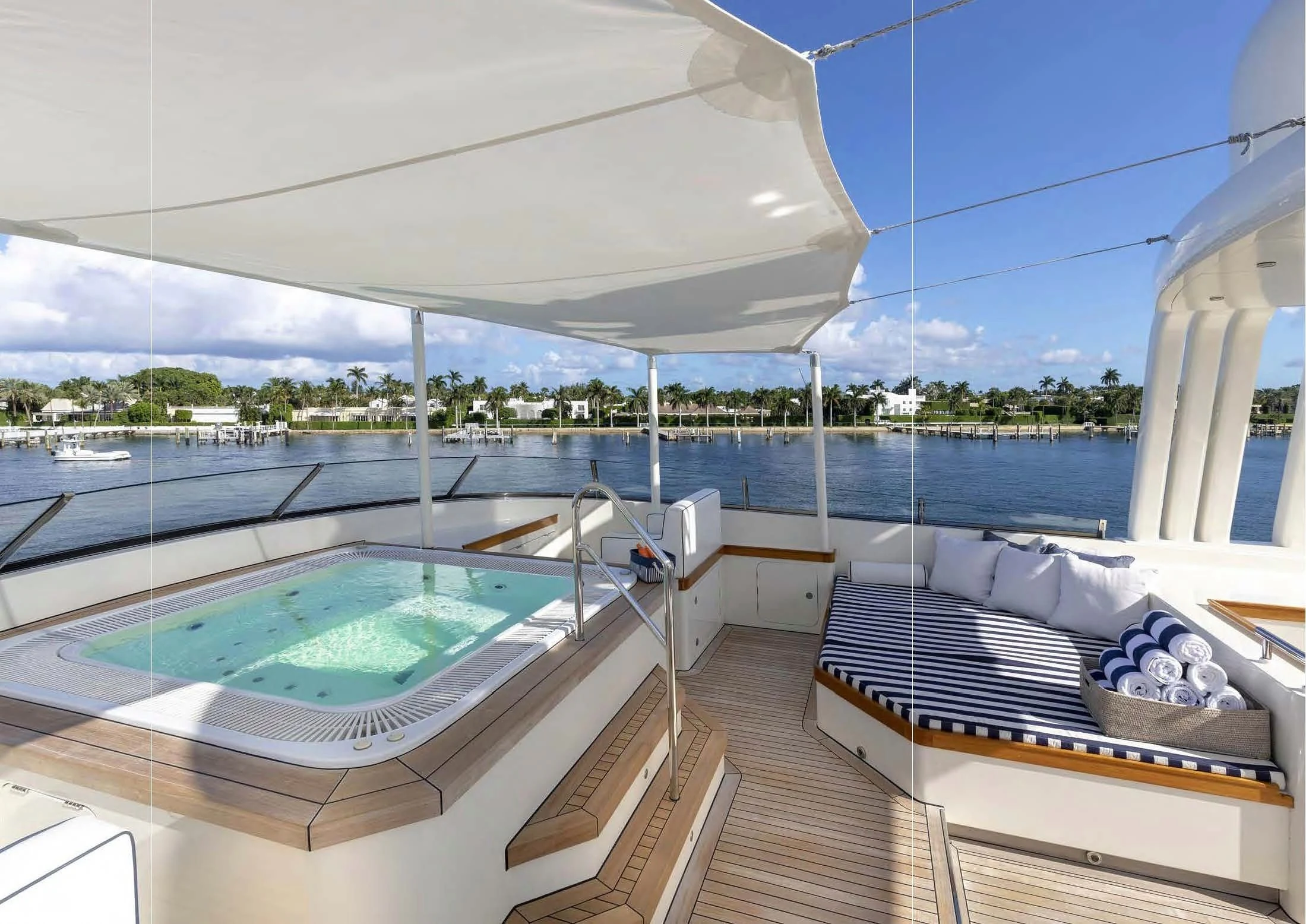 a large balcony overlooking a pool aboard FABULOUS CHARACTER Yacht for Charter