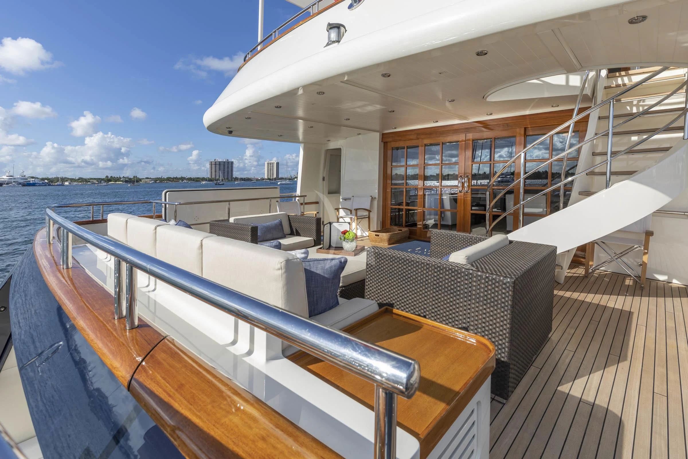 a deck with a view of the water and the city below aboard FABULOUS CHARACTER Yacht for Charter