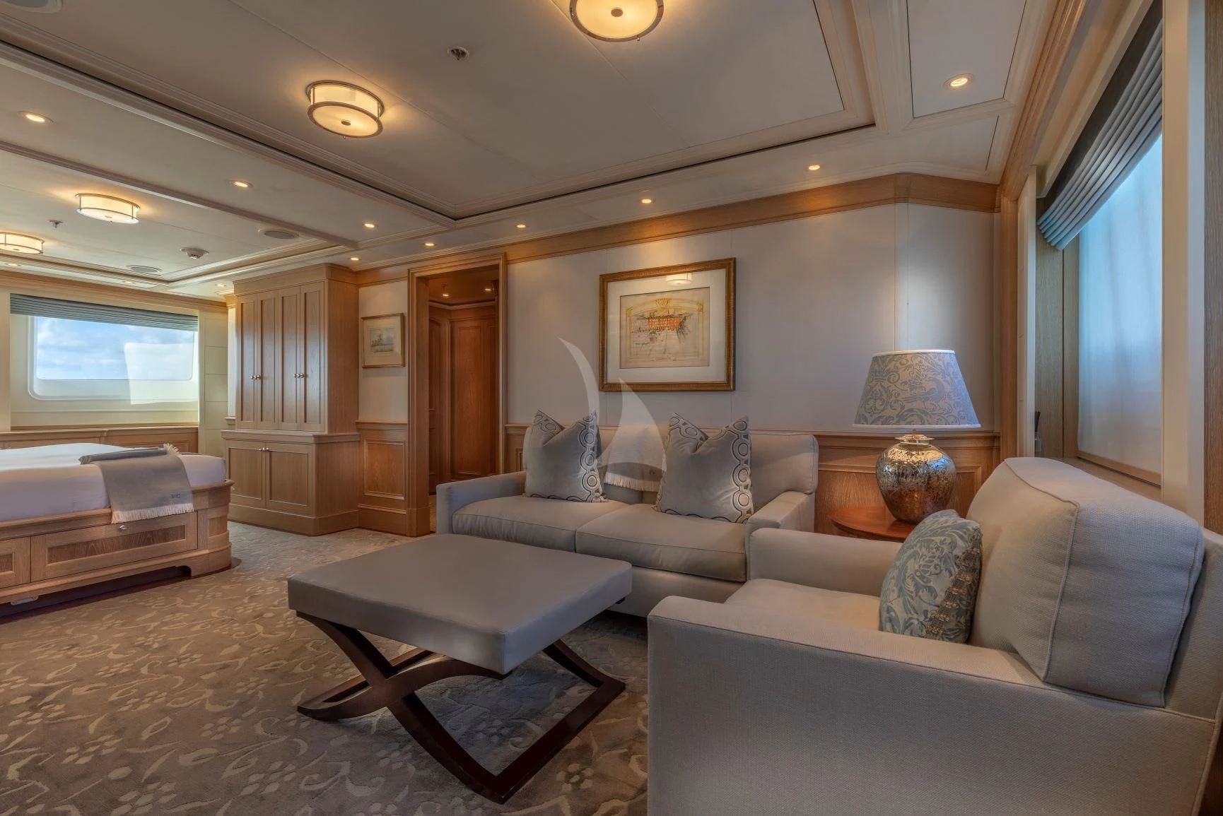 a living room with a couch and a coffee table aboard FABULOUS CHARACTER Yacht for Charter
