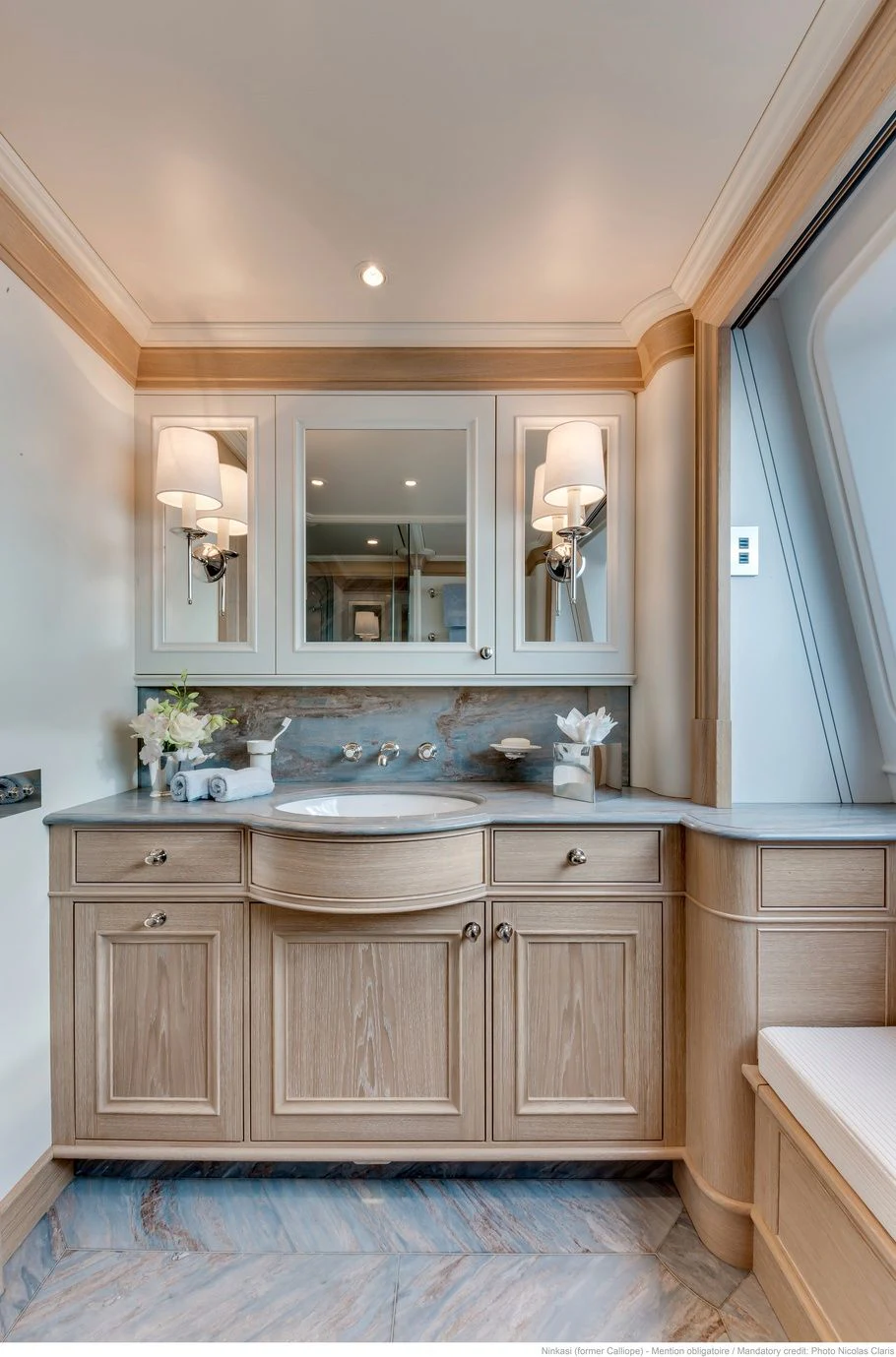 a bathroom with a sink and cabinets aboard FABULOUS CHARACTER Yacht for Charter