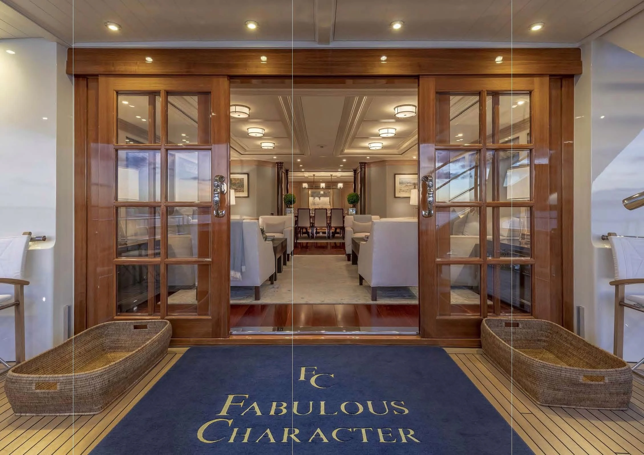 a large room with a large blue swimming pool aboard FABULOUS CHARACTER Yacht for Charter