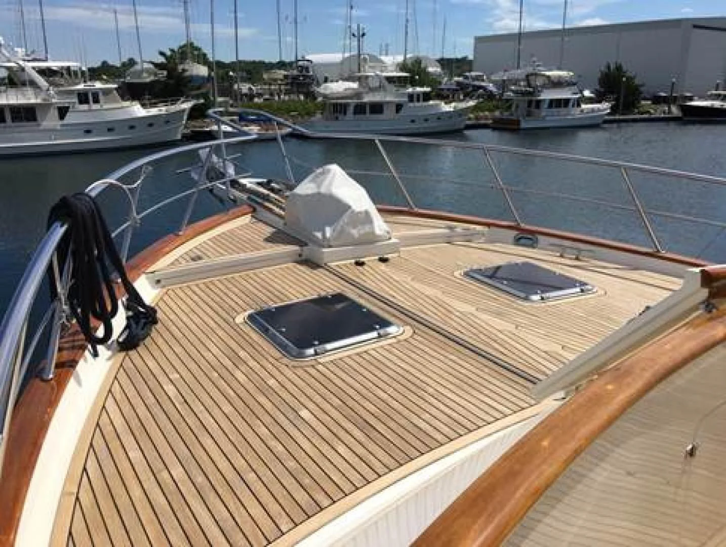 a deck with a laptop on it aboard VK Yacht for Sale