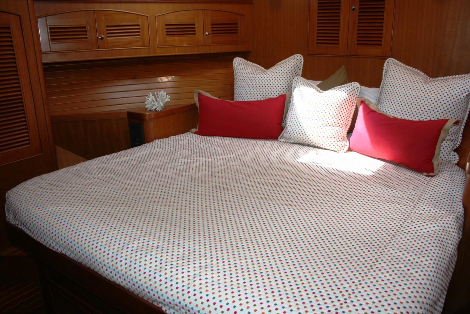 a bed with pillows aboard VK Yacht for Sale