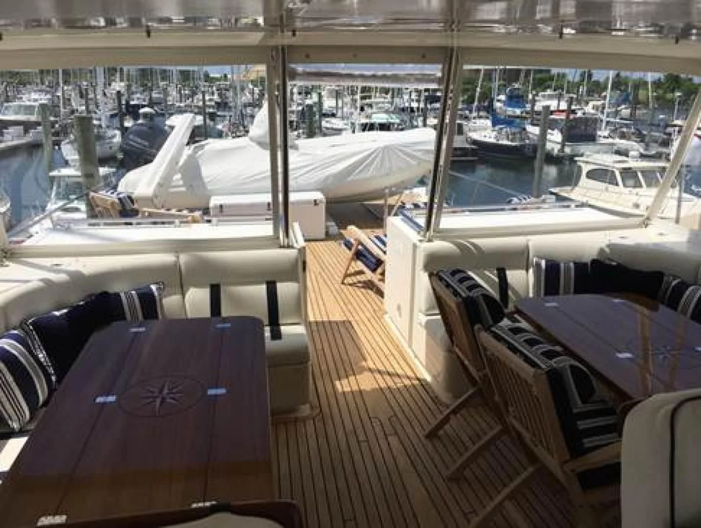 a boat dock with many boats aboard VK Yacht for Sale