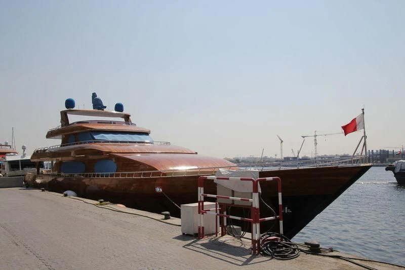 a boat docked at a pier aboard TIGER Yacht for Sale
