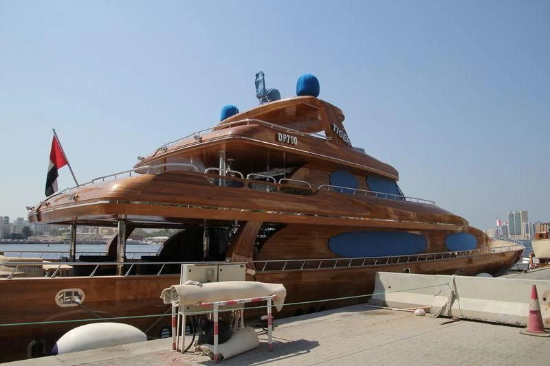 a large boat on a beach aboard TIGER Yacht for Sale