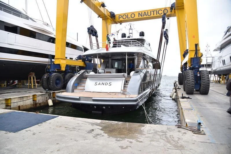 a boat on a dock aboard SANDS Yacht for Sale
