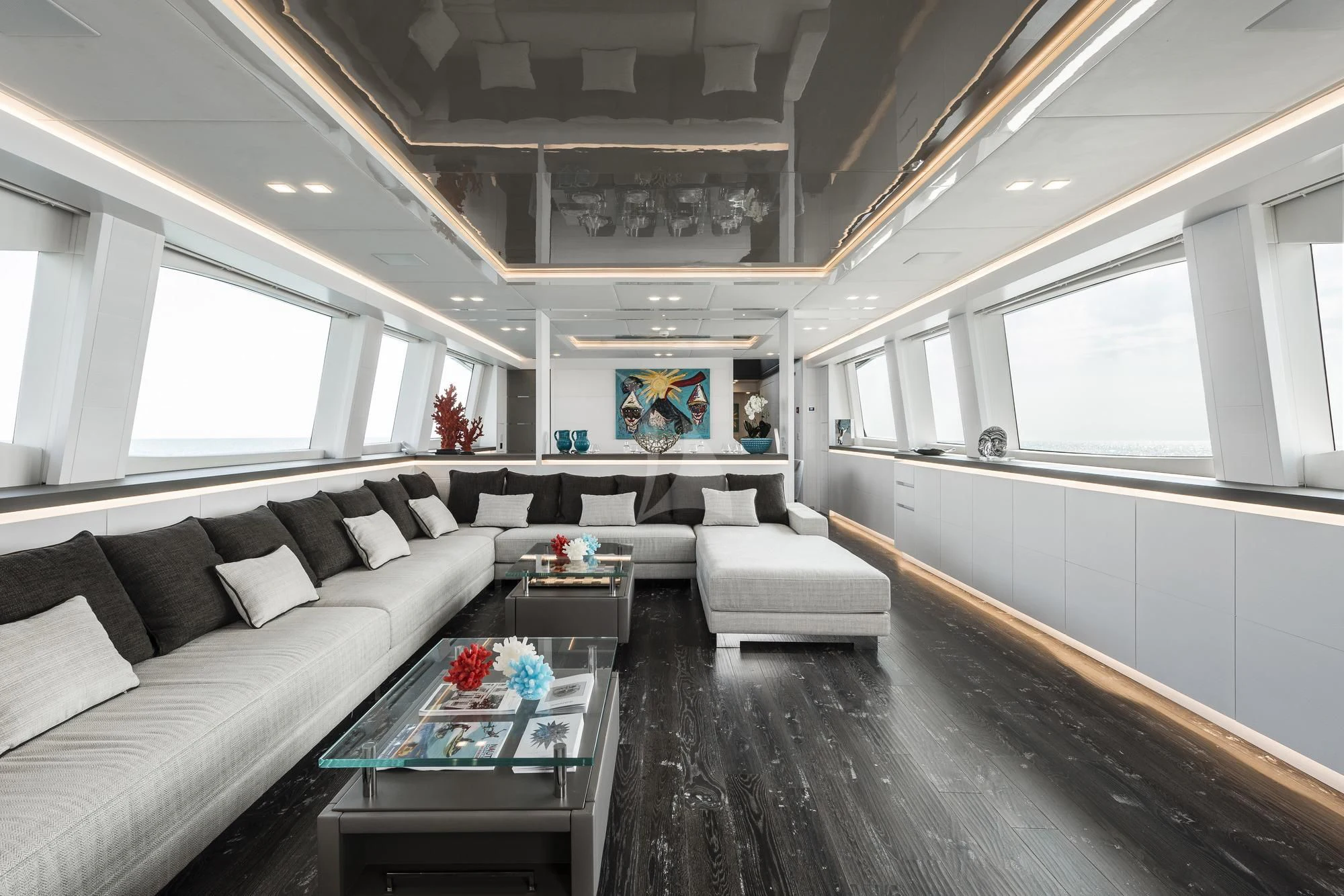 a room with a couch and a table aboard SANDS Yacht for Sale