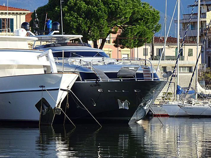 a group of boats are parked in a harbor aboard SANDS Yacht for Sale