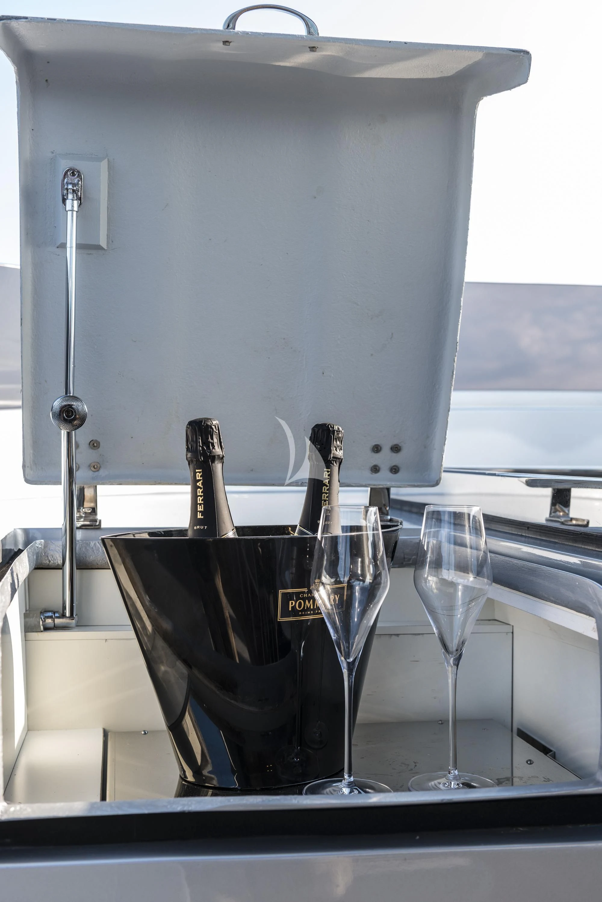 a glass of wine and a bottle aboard SANDS Yacht for Sale