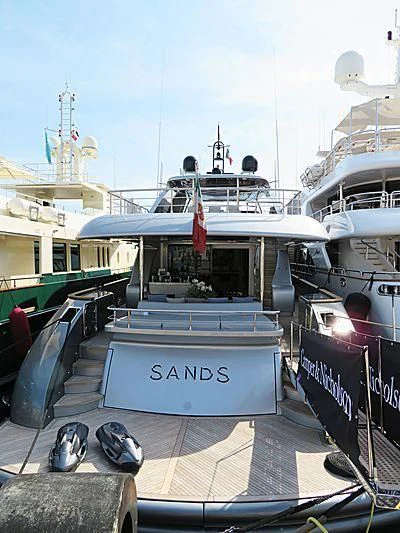 a boat with a sign on the front aboard SANDS Yacht for Sale