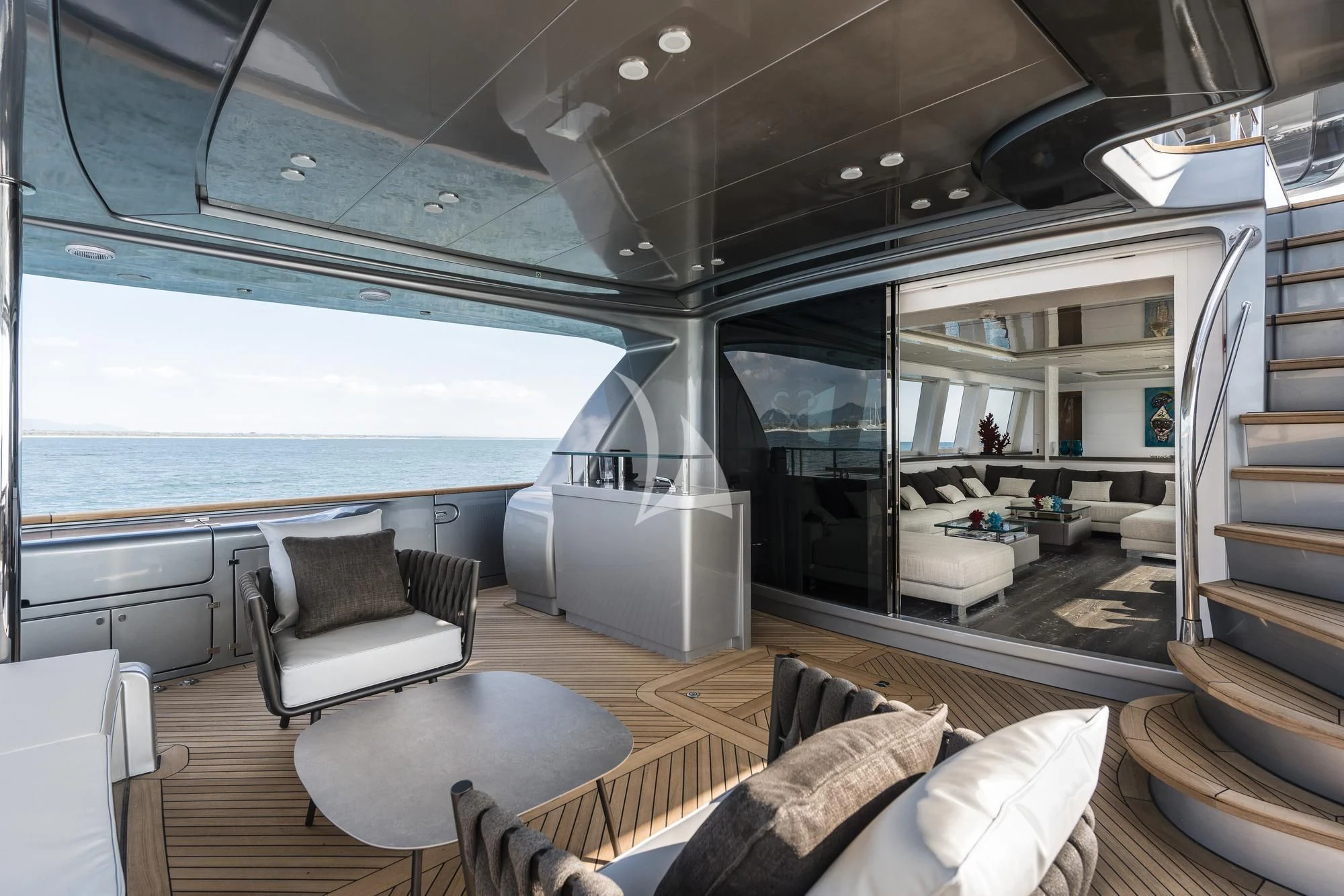 a room with a view of the ocean and the ocean aboard SANDS Yacht for Sale