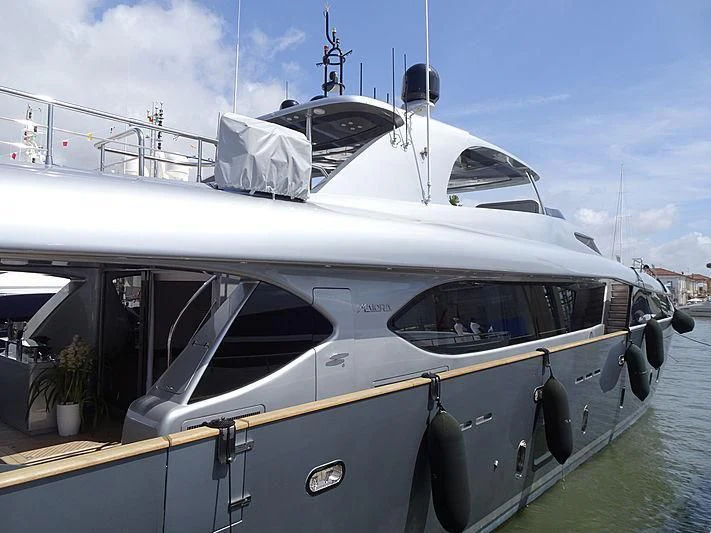 a boat docked at a pier aboard SANDS Yacht for Sale