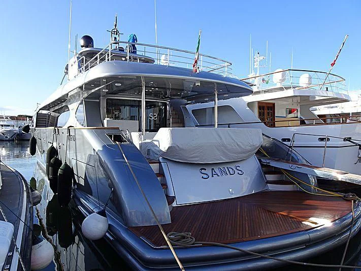 a boat docked at a pier aboard SANDS Yacht for Sale