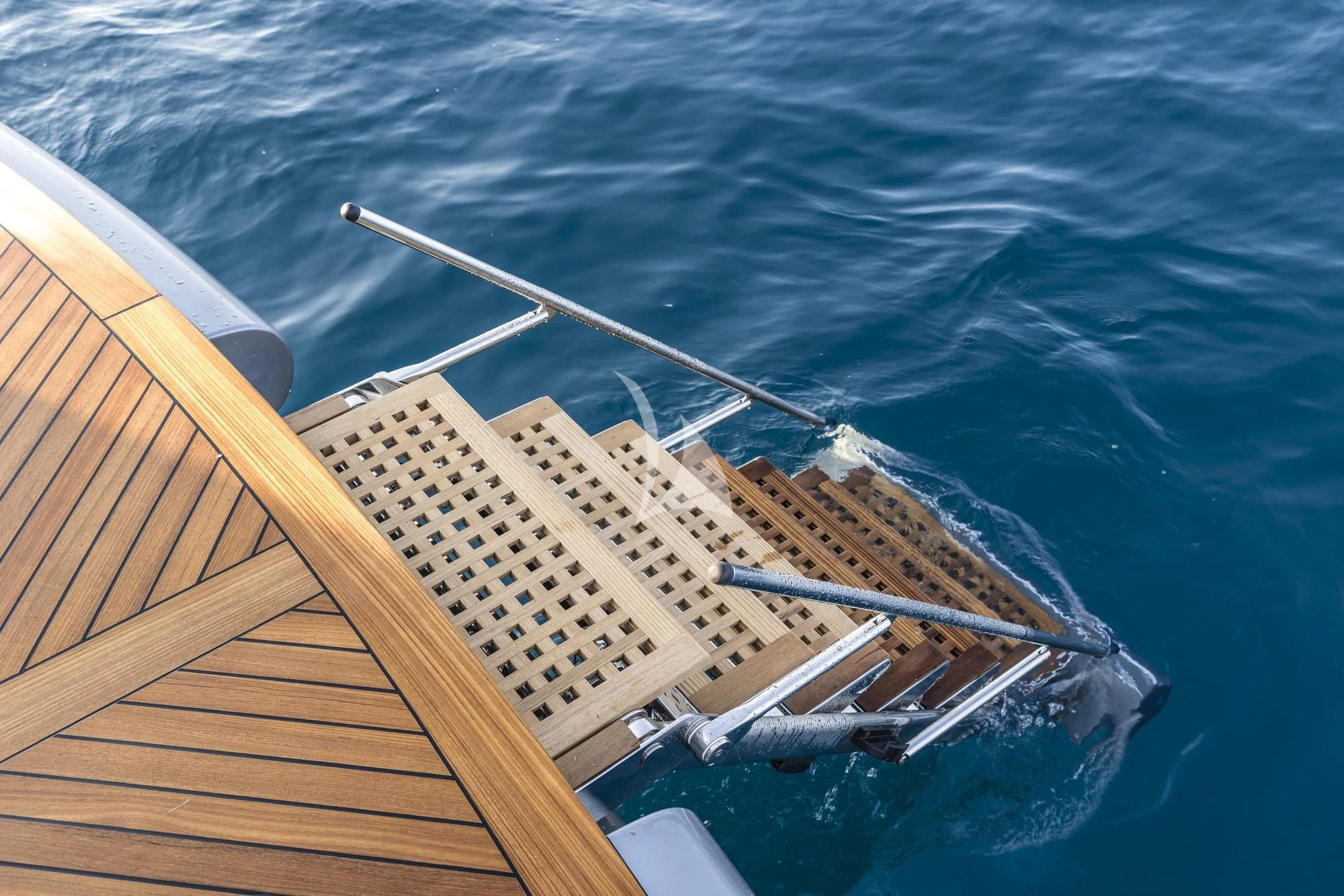 a large ship in the water aboard SANDS Yacht for Sale