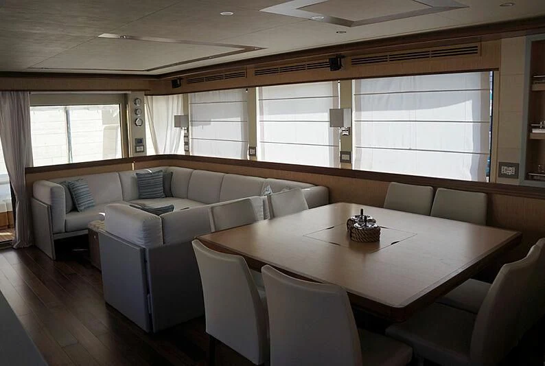 a living room with a couch and a table aboard SANGRIA Yacht for Sale