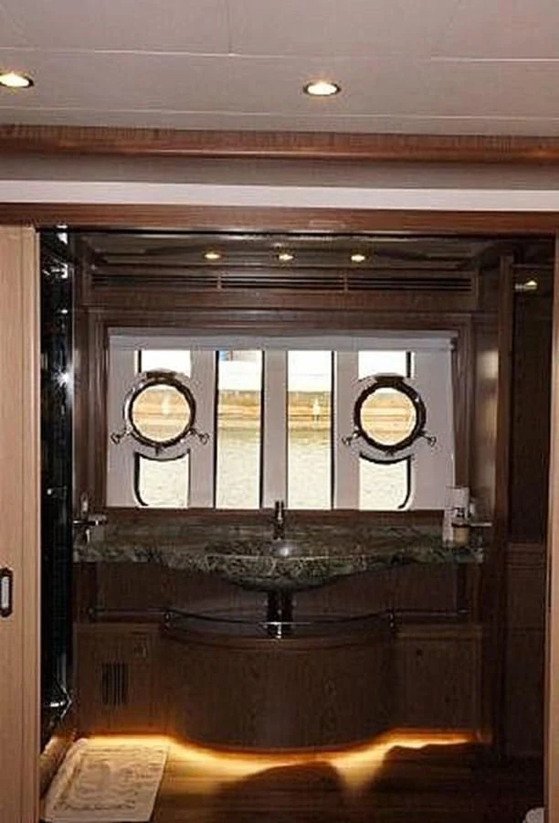 a large bathroom with a large mirror aboard SANGRIA Yacht for Sale
