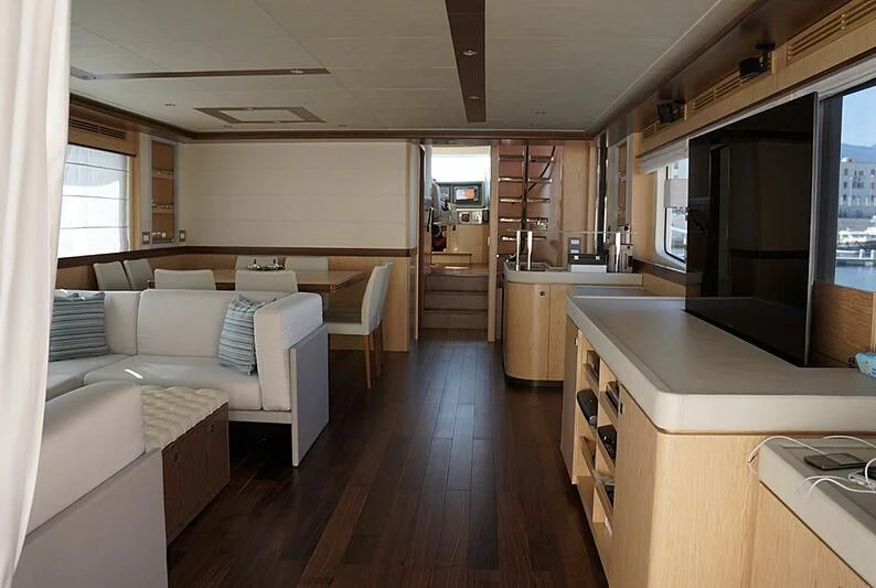 a room with a couch and a television aboard SANGRIA Yacht for Sale
