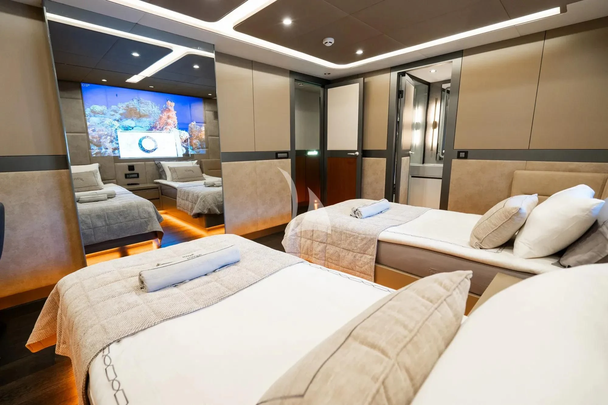 a room with a bed and a tv on the wall aboard NORTH WIND Yacht for Sale