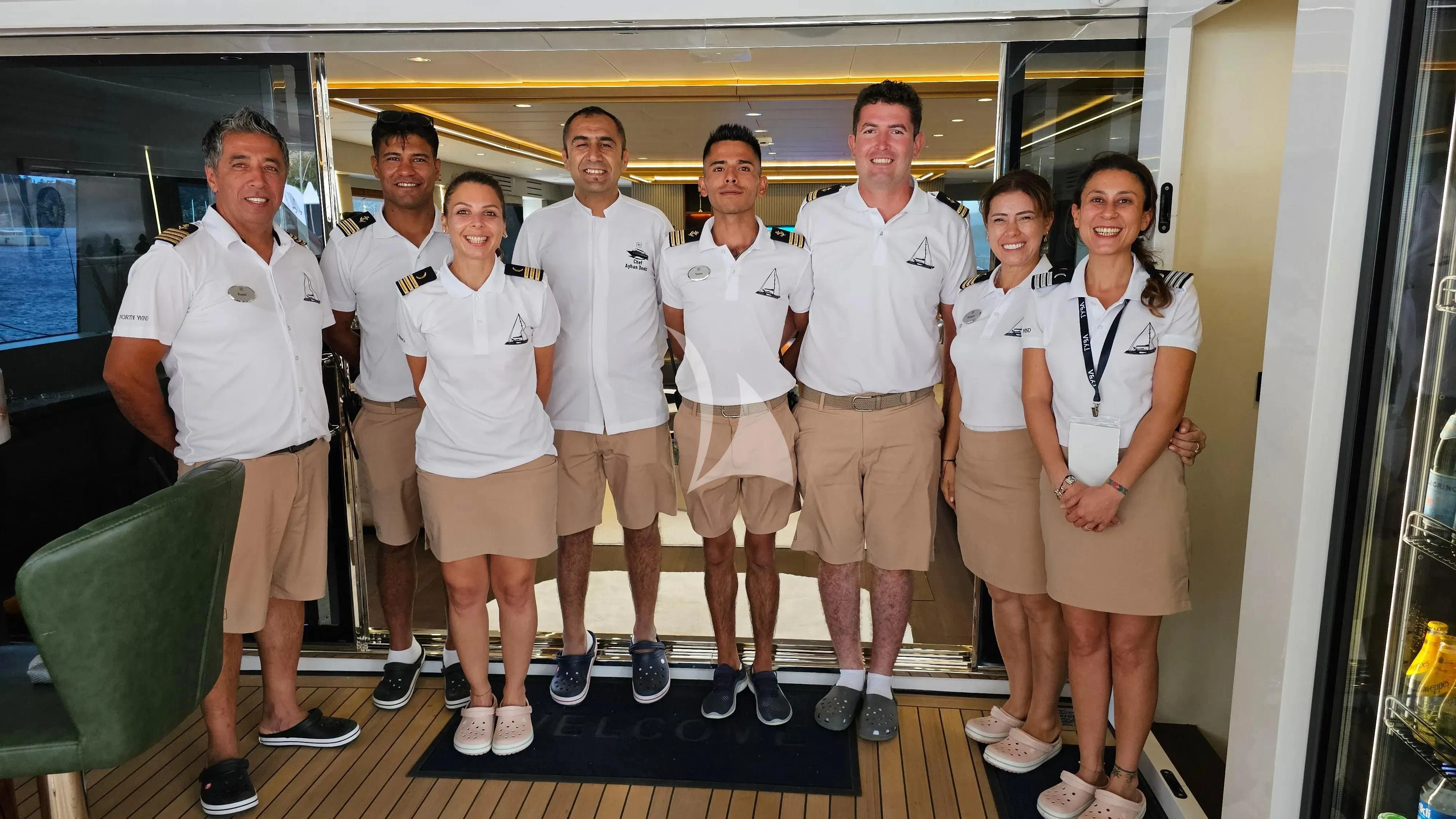 a group of people posing for a photo aboard NORTH WIND Yacht for Sale