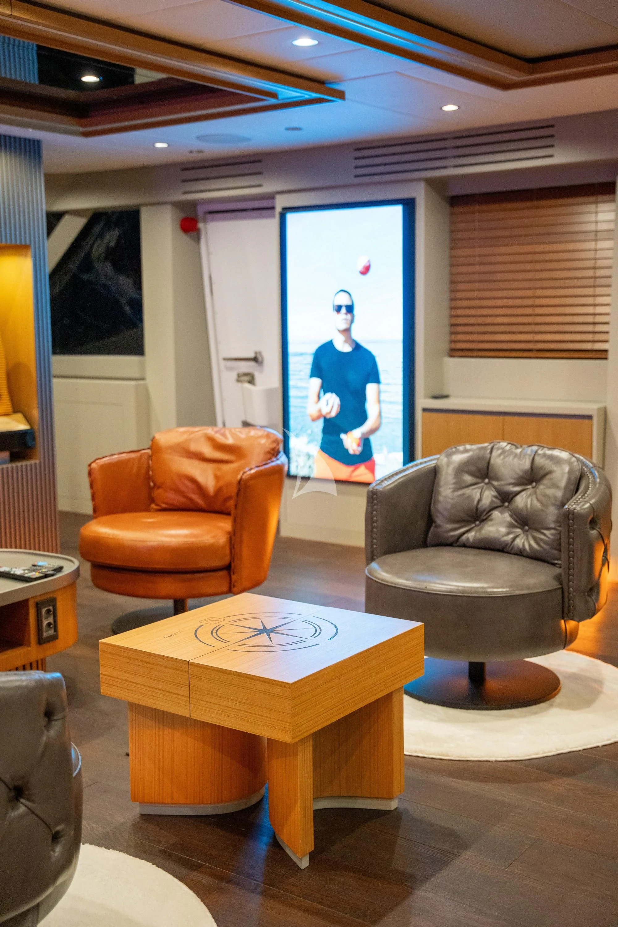 a room with a table and chairs aboard NORTH WIND Yacht for Sale