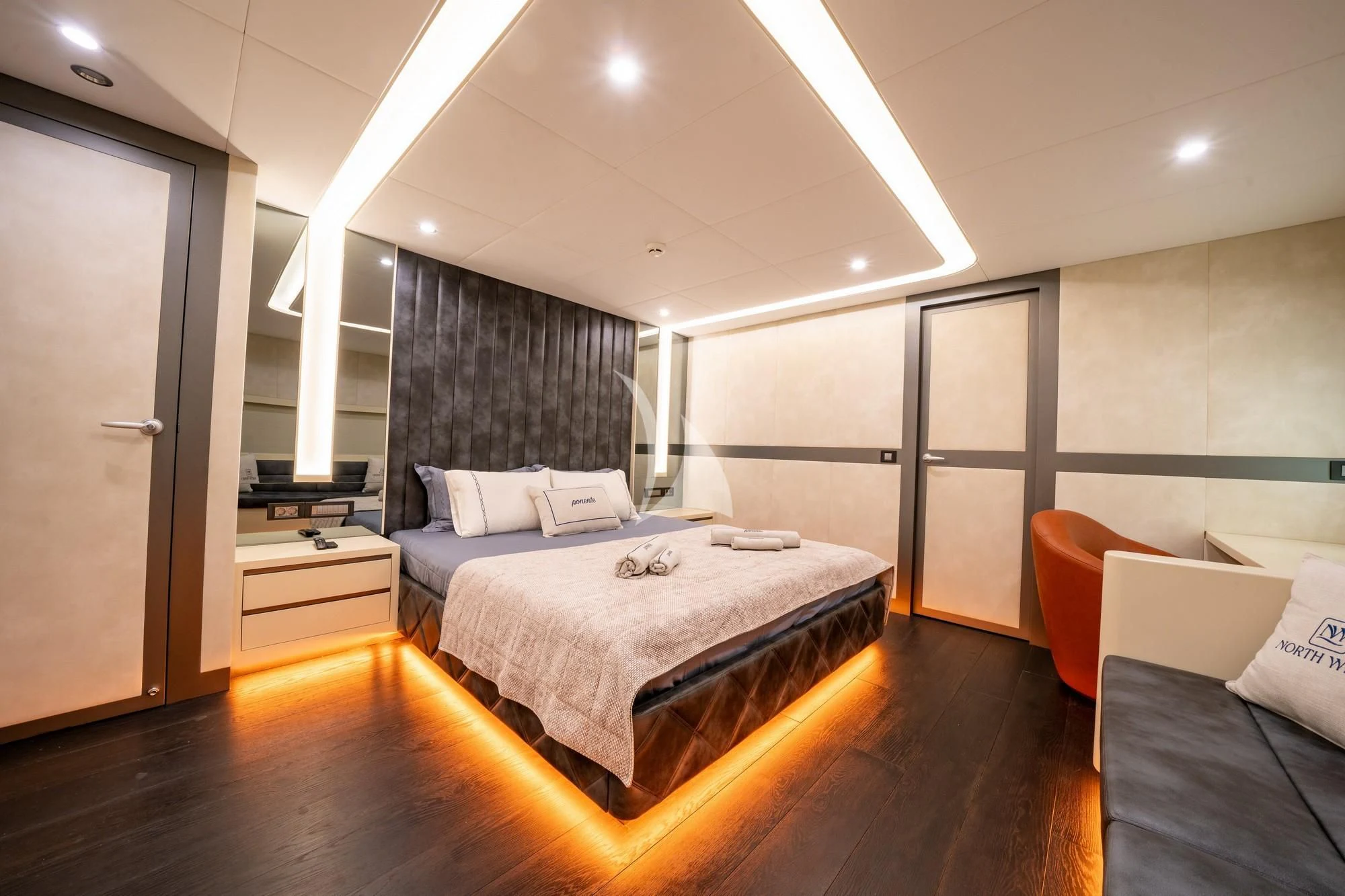 a bedroom with a bed and a desk aboard NORTH WIND Yacht for Sale