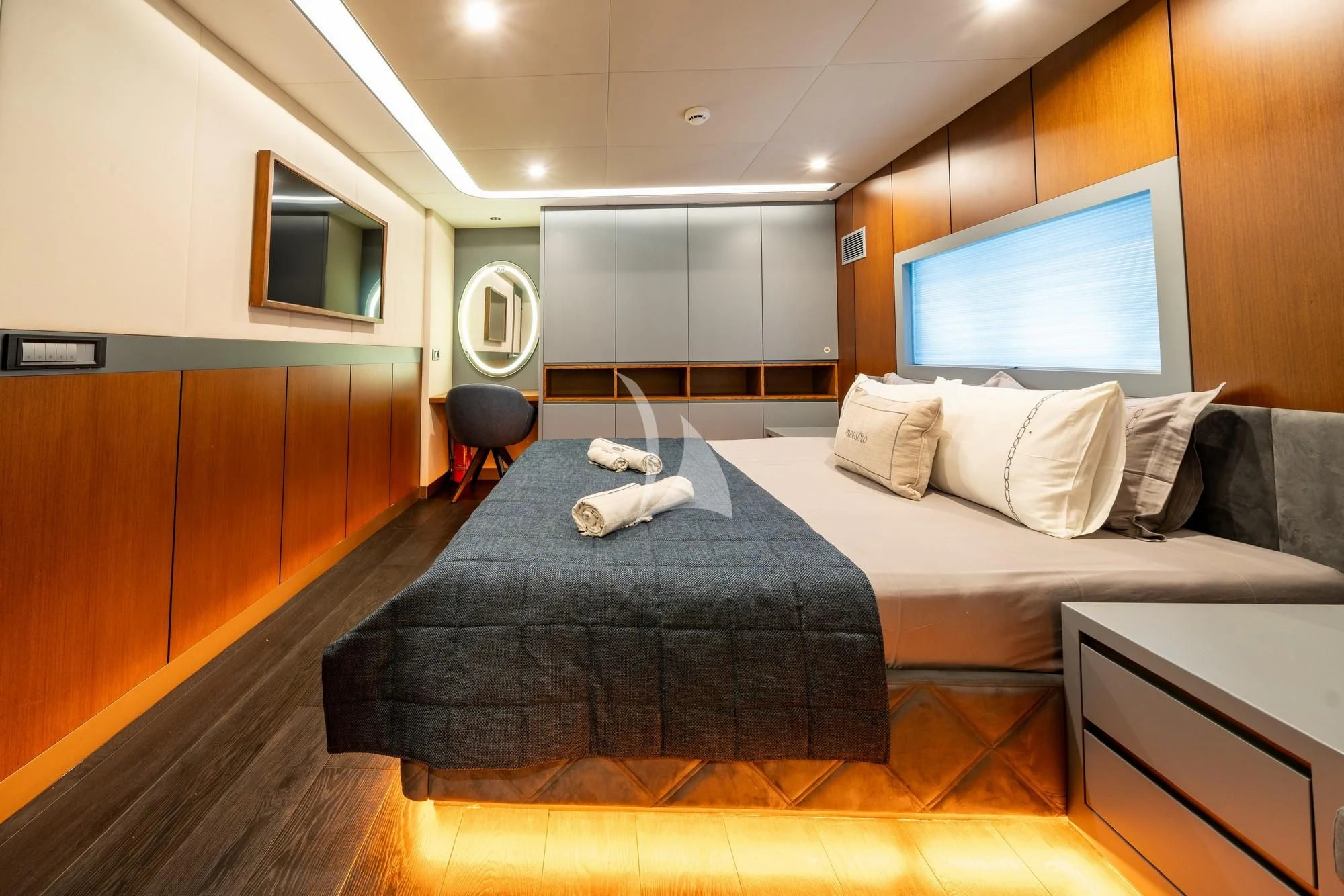 a cat lying on a bed aboard NORTH WIND Yacht for Sale