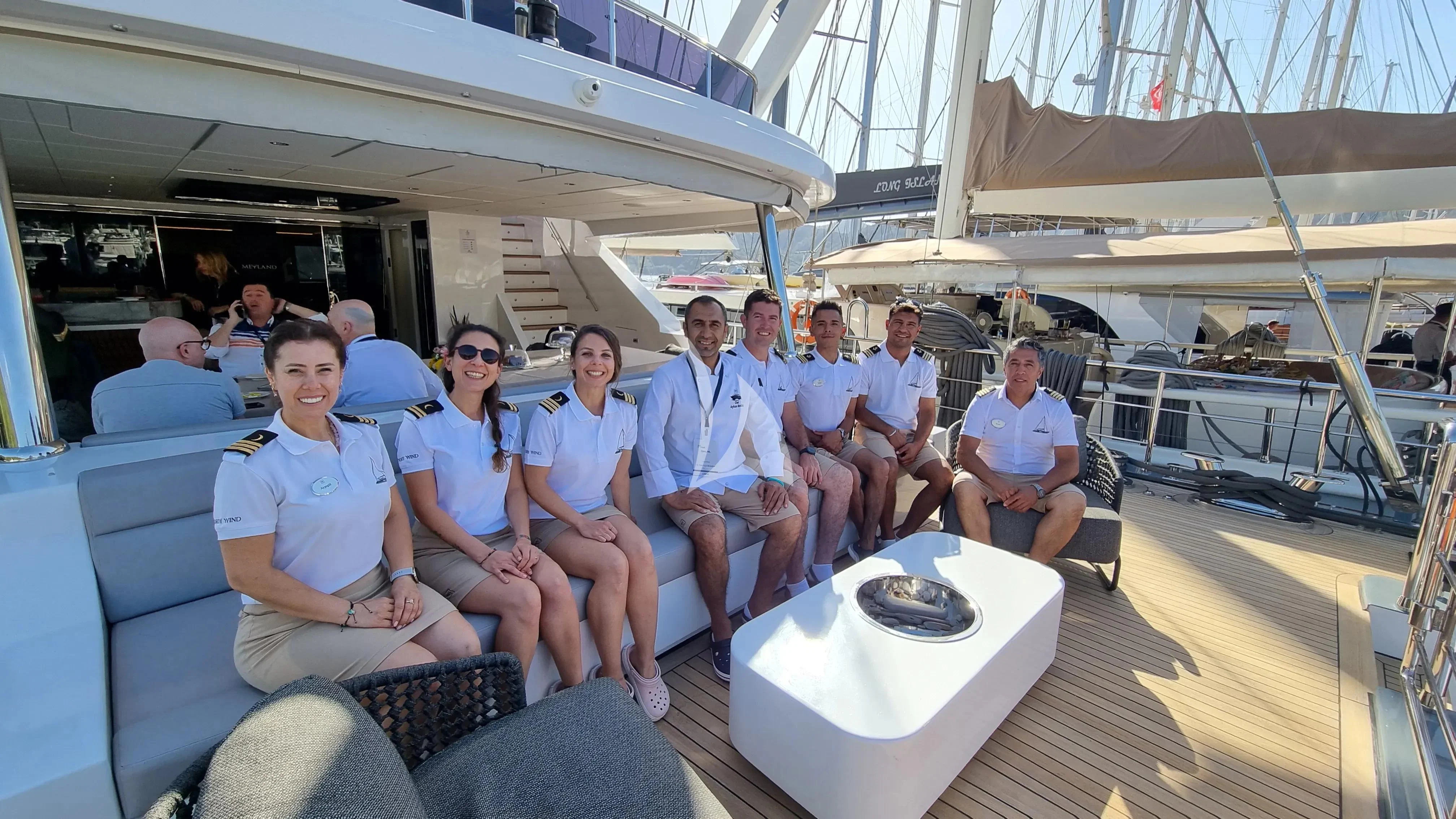 a group of people sitting in a boat aboard NORTH WIND Yacht for Sale