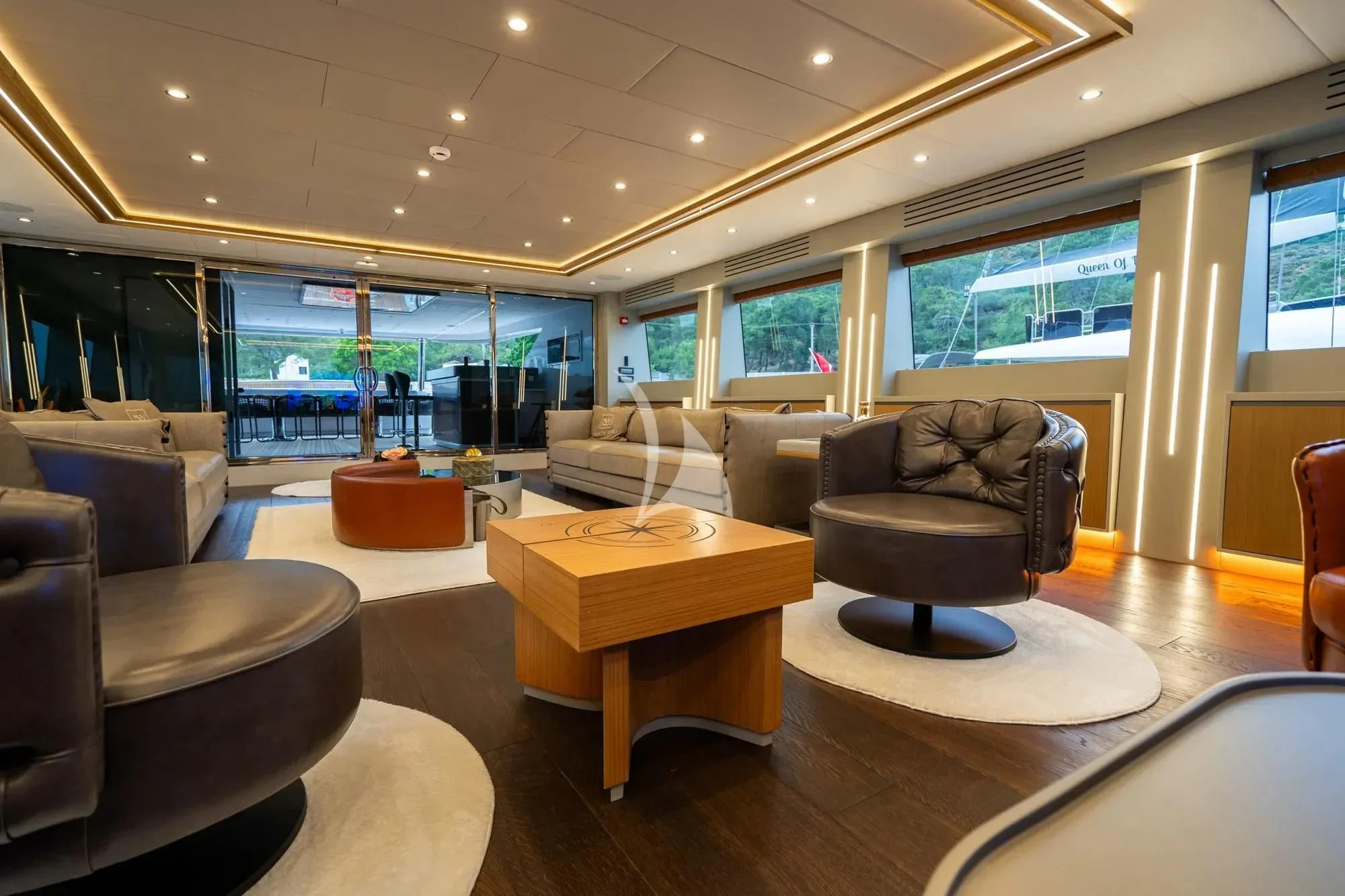 a living room with a couch and a coffee table aboard NORTH WIND Yacht for Sale