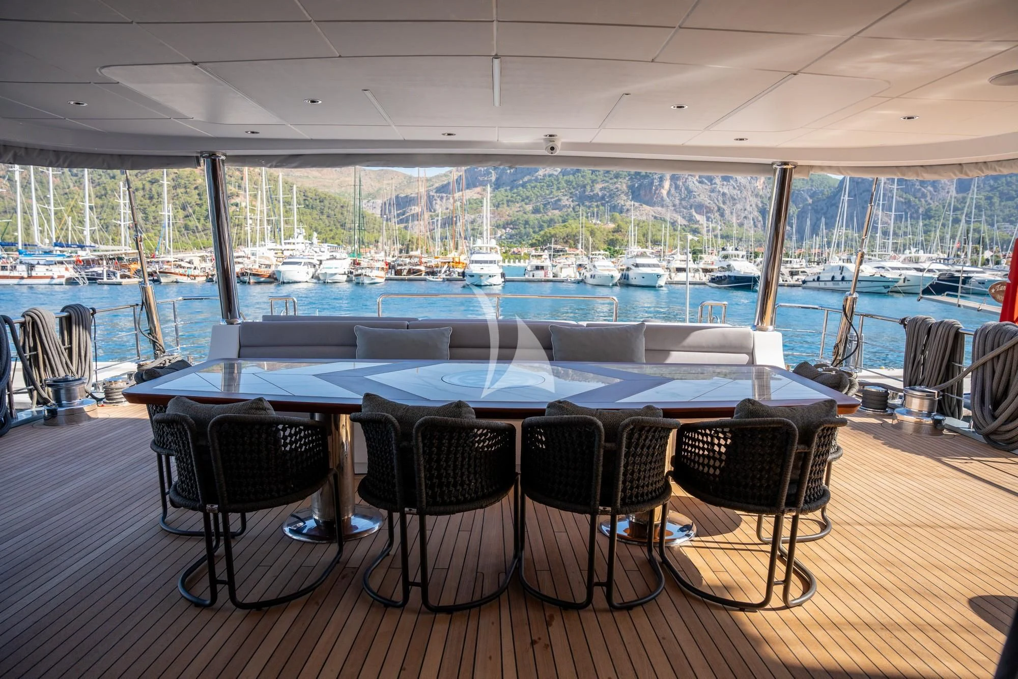a table and chairs on a deck aboard NORTH WIND Yacht for Sale