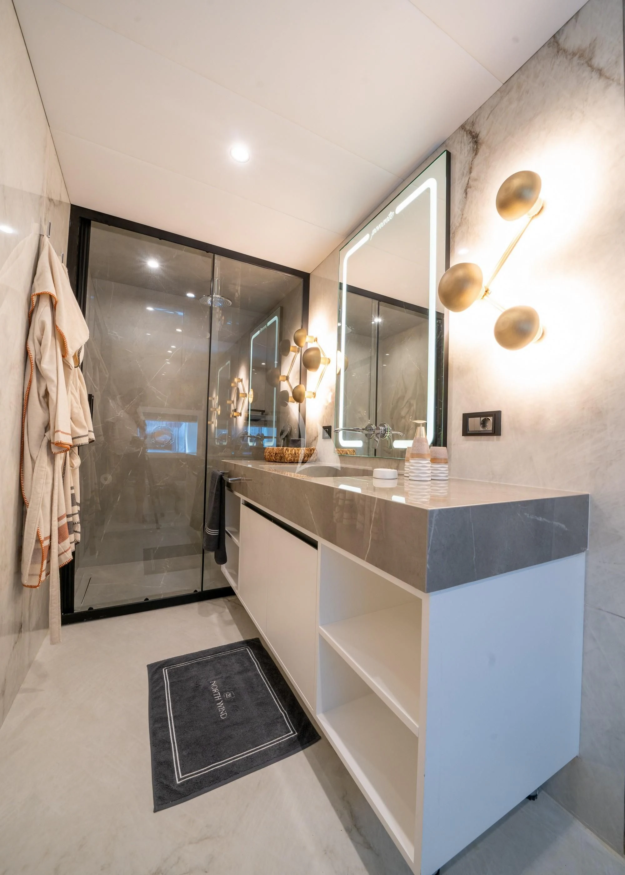 a bathroom with a large mirror aboard NORTH WIND Yacht for Sale