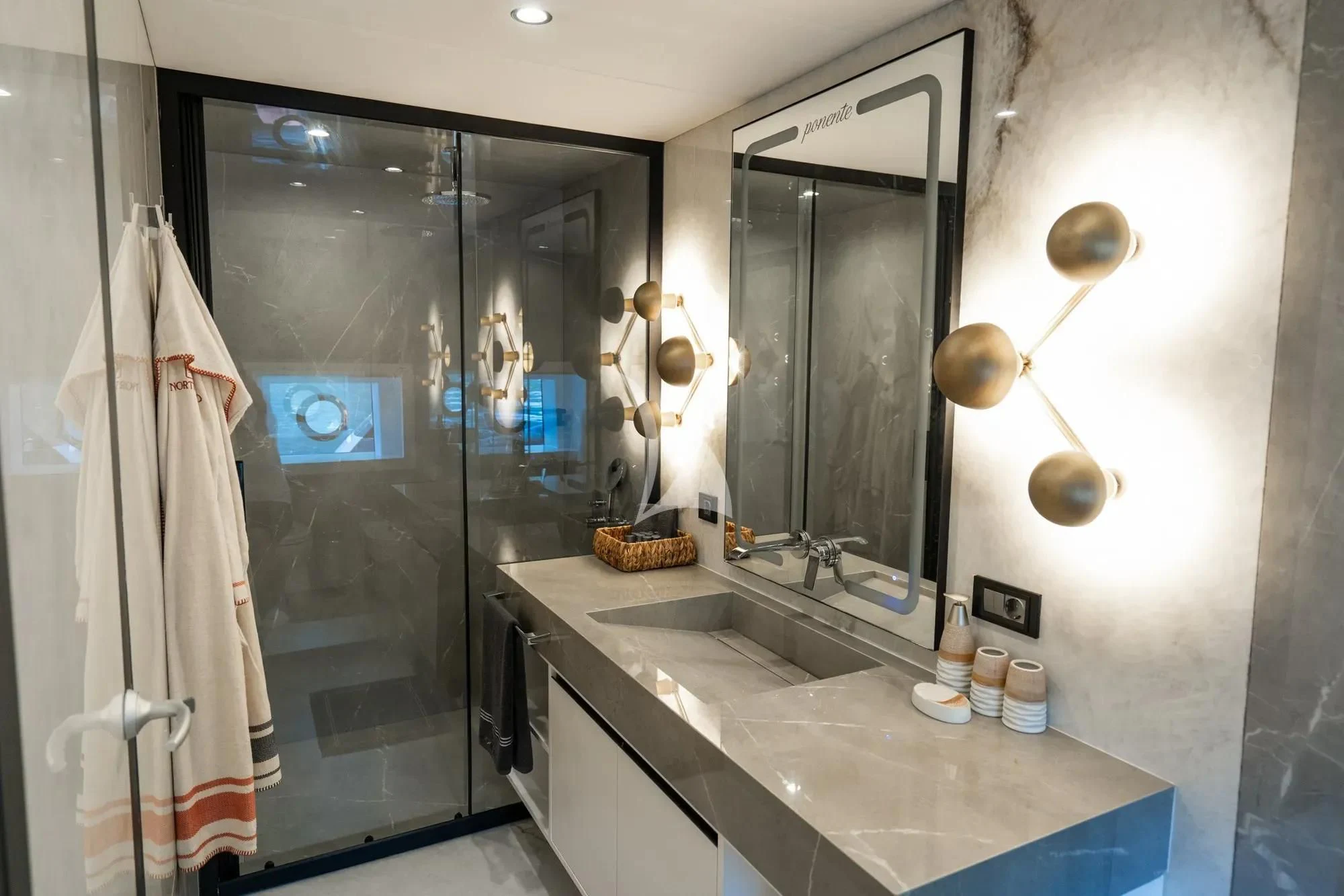 a bathroom with a sink and a mirror aboard NORTH WIND Yacht for Sale