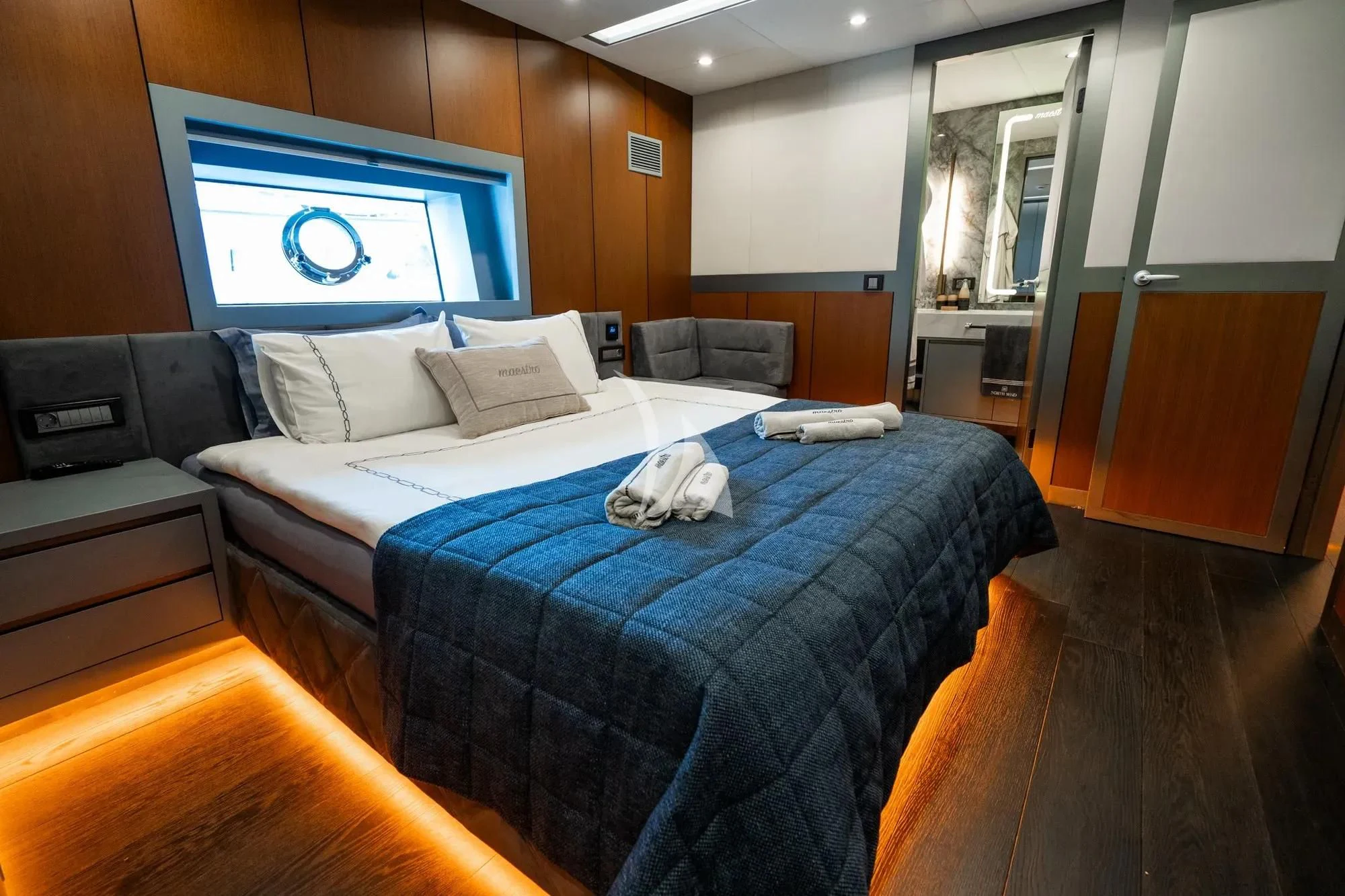 a room with a bed and a tv on the wall aboard NORTH WIND Yacht for Sale
