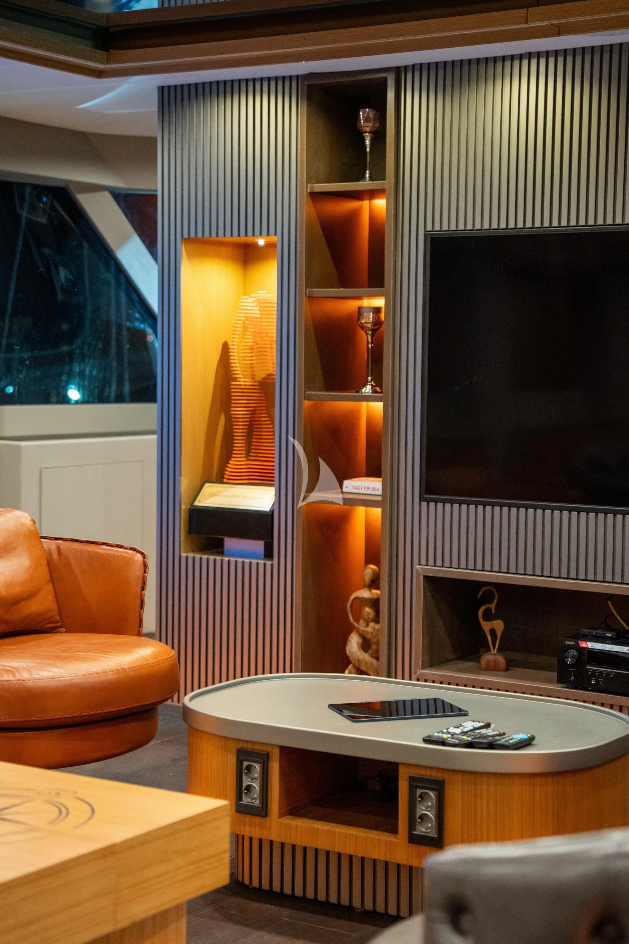 a living room with a large tv aboard NORTH WIND Yacht for Sale