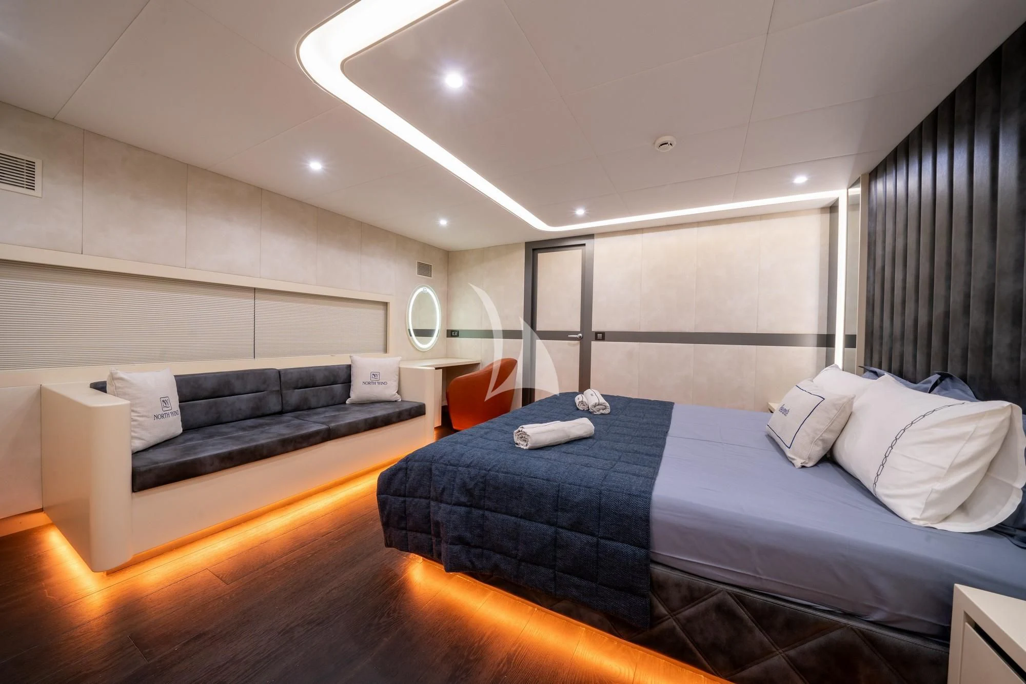a room with a bed and a couch aboard NORTH WIND Yacht for Sale