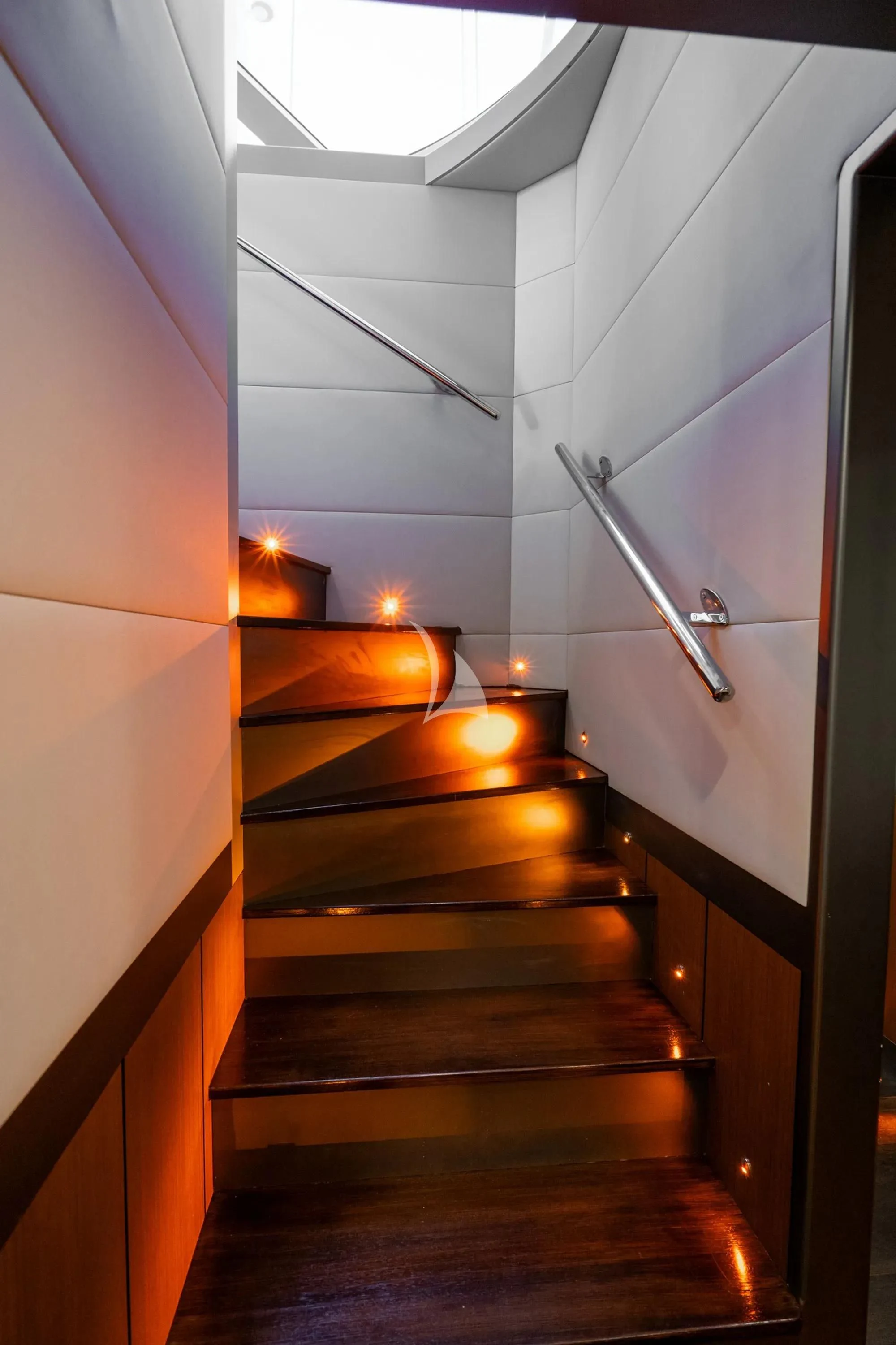 a staircase with a light on the side aboard NORTH WIND Yacht for Sale