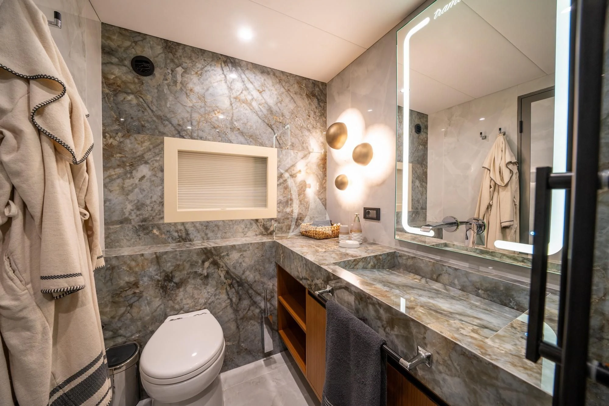 a bathroom with a marble countertop aboard NORTH WIND Yacht for Sale