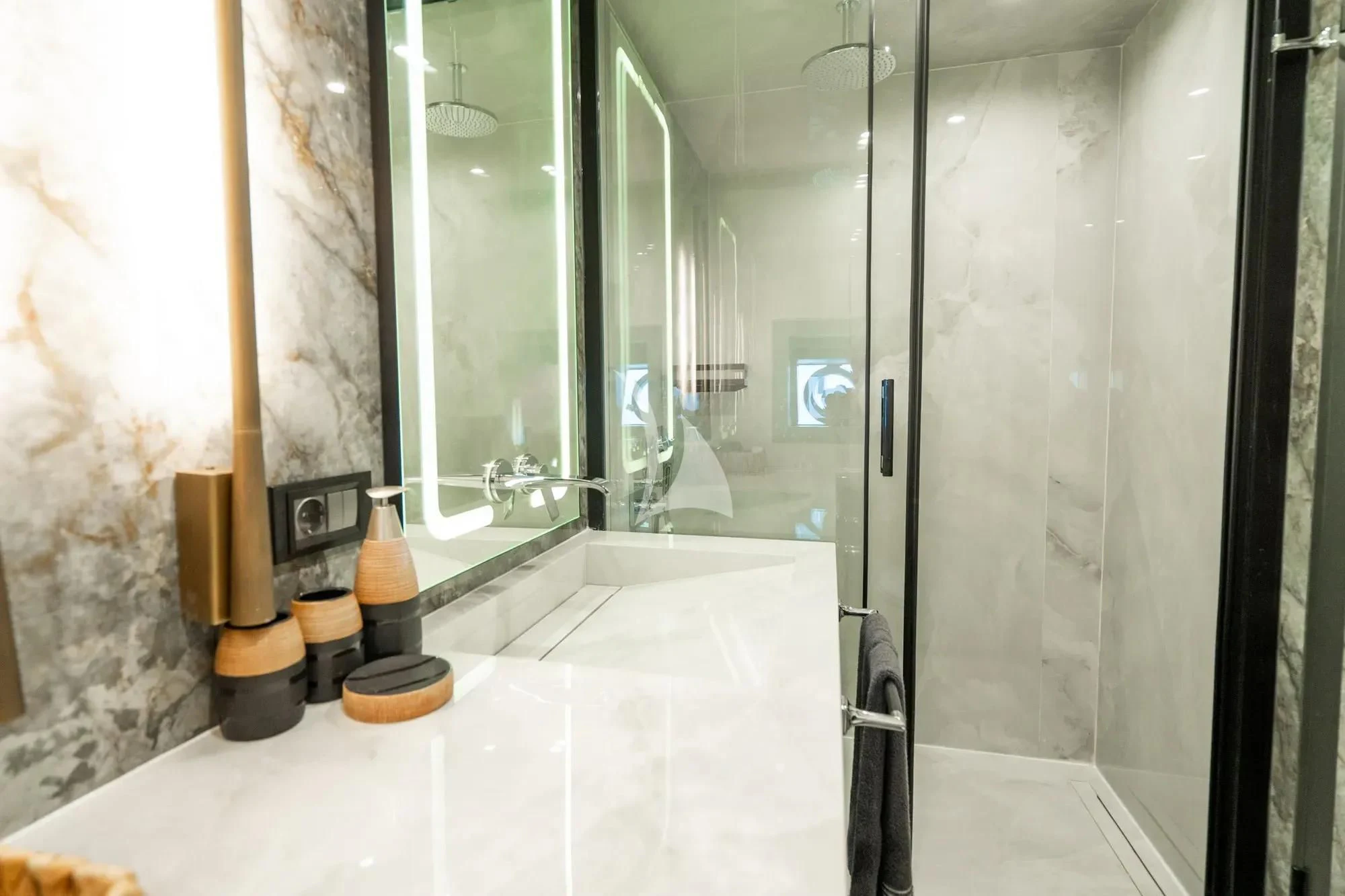 a bathroom with a glass shower aboard NORTH WIND Yacht for Sale
