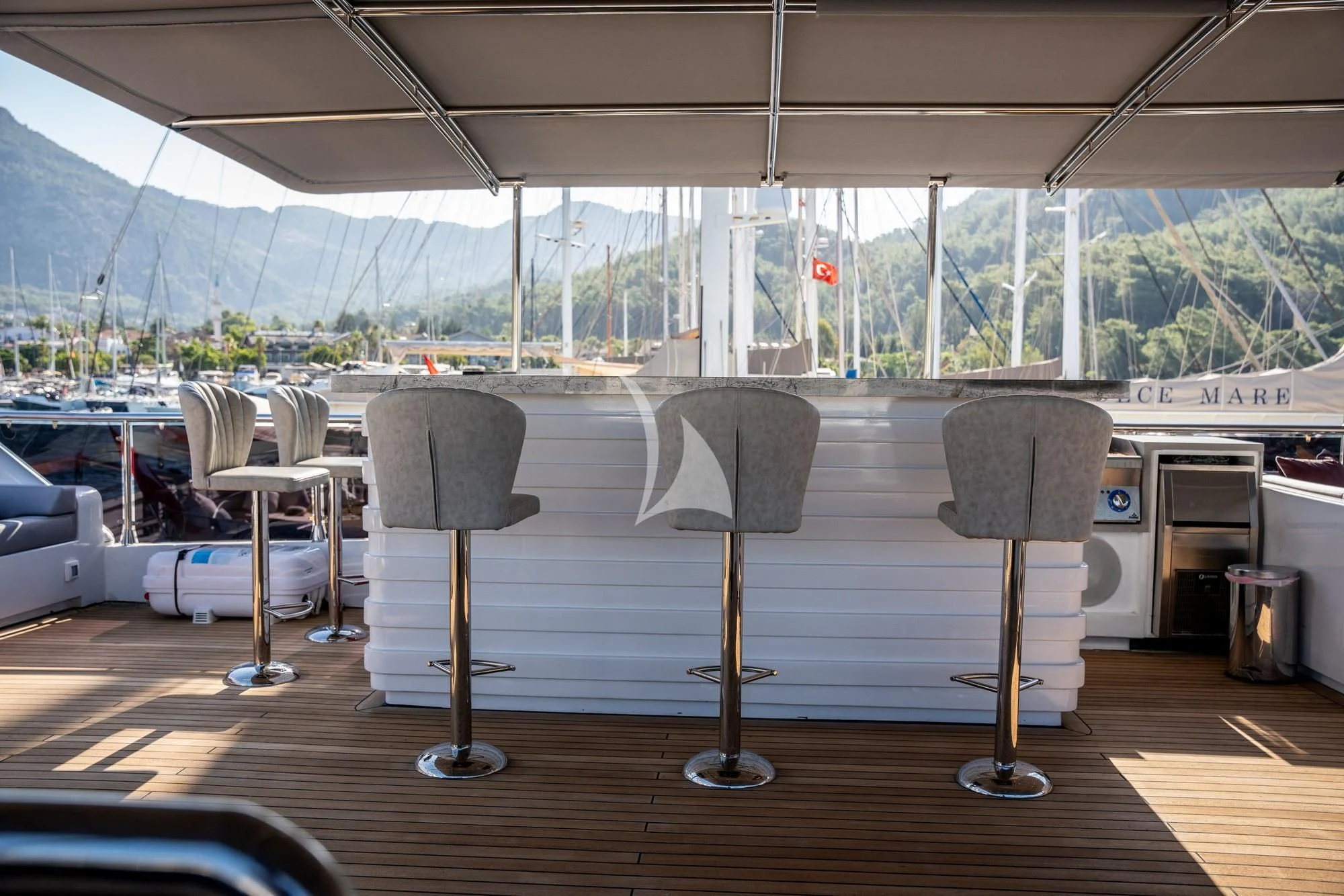 a room with tables and chairs aboard NORTH WIND Yacht for Sale