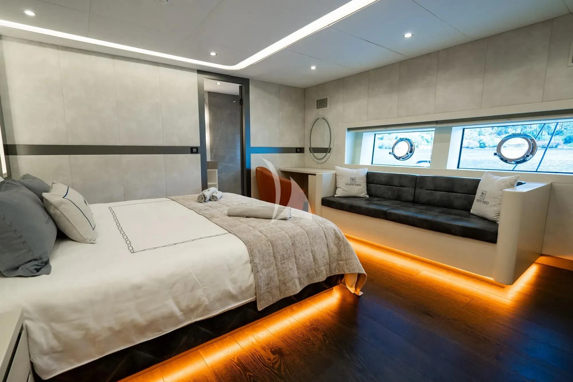 a room with a bed and a couch aboard NORTH WIND Yacht for Sale