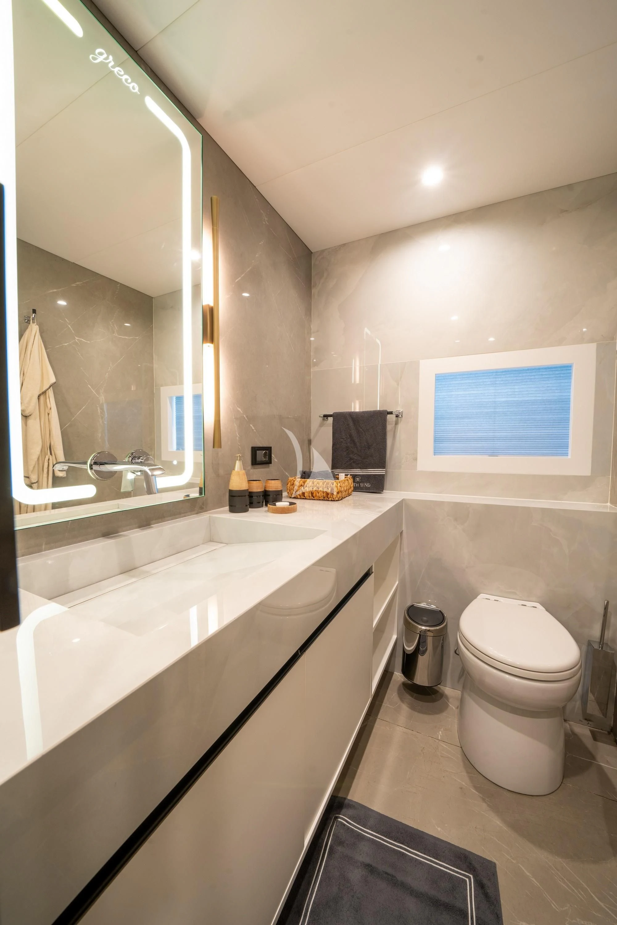 a bathroom with a toilet and a sink aboard NORTH WIND Yacht for Sale