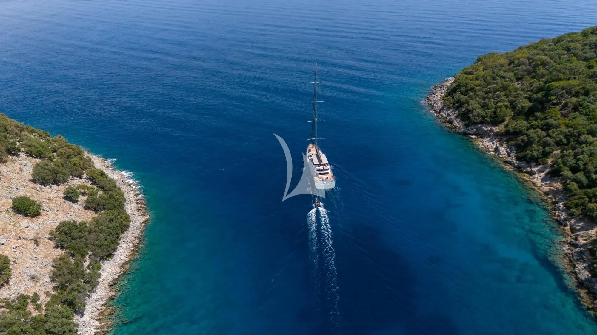 a long white boat in the water aboard NORTH WIND Yacht for Sale